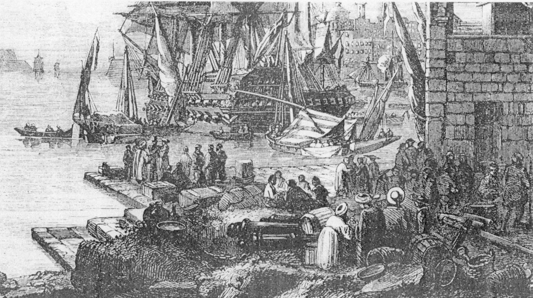 Des commer&ccedil;ants Maltais attendant sur le quai de Ras Hanzir, pr&ecirc;ts &agrave; embarquer pour des ports m&eacute;diterran&eacute;ens